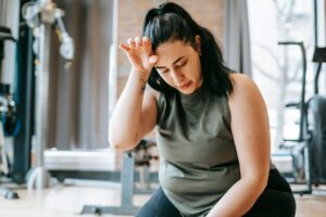 tired female training at gym