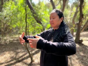 Melissa Roxas acupuncturist, Qigong teacher in WuJi posture of stillness.