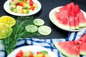 summer foods like watermelon, lemon and cucumber pictured